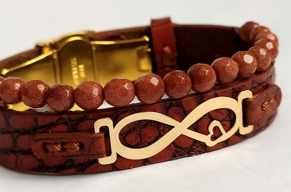 دستبند چرم با پلاک طلا طرح بینهایت، نماد عشق، ماندگاری و زیبایی